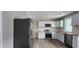 Modern kitchen with stainless steel appliances, white cabinets, and a wood countertop at 884 Thurmond Nw St, Atlanta, GA 30314