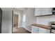 Modern kitchen with white cabinets, stainless steel appliances, and a wood countertop at 884 Thurmond Nw St, Atlanta, GA 30314