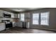 Bright kitchen featuring white cabinets, stainless appliances, and butcher block countertops at 884 Thurmond Nw St, Atlanta, GA 30314