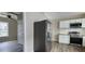 Modern kitchen with stainless steel appliances, white cabinets, and a wood countertop at 884 Thurmond Nw St, Atlanta, GA 30314