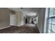 Open concept living room with wood floors and access to the kitchen with stainless steel appliances at 884 Thurmond Nw St, Atlanta, GA 30314