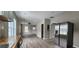 Open floor plan showing the kitchen blending into the living room with stainless appliances at 884 Thurmond Nw St, Atlanta, GA 30314