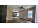 Open concept living room with wood floors and access to the kitchen with stainless steel appliances at 884 Thurmond Nw St, Atlanta, GA 30314