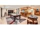 Finished basement with a pool table, bar, dart board, and stylish decor is an entertainment dream at 1438 Janmar Rd, Snellville, GA 30078