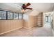 Spacious upper level bonus room with a ceiling fan and natural light at 1438 Janmar Rd, Snellville, GA 30078