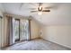 Bedroom with private balcony, neutral carpeting, and lots of natural light at 1438 Janmar Rd, Snellville, GA 30078