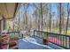 Enjoy the outdoors on this covered deck with beautiful views of the lush surrounding trees at 1438 Janmar Rd, Snellville, GA 30078