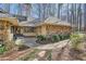 Beautiful stone accents add interest to this single story home surrounded by manicured landscaping at 1438 Janmar Rd, Snellville, GA 30078