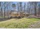 Well-maintained home with stone accents, manicured lawn, and mature trees at 1438 Janmar Rd, Snellville, GA 30078