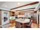 Bright kitchen with wood cabinets, central island and stainless steel appliances at 1438 Janmar Rd, Snellville, GA 30078
