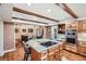 Modern kitchen with wood cabinets, central island and stainless steel appliances at 1438 Janmar Rd, Snellville, GA 30078