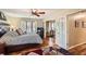Bright main bedroom with hardwood floors, ceiling fan, and access to an office at 1438 Janmar Rd, Snellville, GA 30078