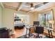 View into the bedroom from the office with natural light and hardwood floors at 1438 Janmar Rd, Snellville, GA 30078
