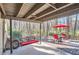 Relaxing outdoor patio with a swing, table, and chairs offers a peaceful retreat at 1438 Janmar Rd, Snellville, GA 30078