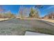 Large, grassy backyard, perfect for outdoor activities and entertaining, surrounded by trees at 2413 Brynlynn Woods, Conyers, GA 30013