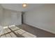 This carpeted bedroom features a ceiling light, a door, and neutral walls at 2413 Brynlynn Woods, Conyers, GA 30013