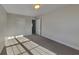 This bedroom has neutral paint and carpeting, with a door and ceiling light at 2413 Brynlynn Woods, Conyers, GA 30013