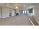 Expansive main bedroom with a fireplace, ceiling fan, and sitting area, offering a luxurious retreat at 2413 Brynlynn Woods, Conyers, GA 30013