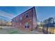 Exterior showcases a well-maintained brick facade, multiple windows, and a fenced yard at 2413 Brynlynn Woods, Conyers, GA 30013