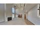 Spacious living room with a fireplace, high ceilings, and an open floor plan to the kitchen at 2413 Brynlynn Woods, Conyers, GA 30013