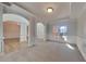 Open living room with light carpet, large windows, and decorative pillars creates an airy feel at 2413 Brynlynn Woods, Conyers, GA 30013