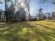 Over 1 acre lot featuring a large backyard with deck and walkout basement at 2784 Williamsburg Way, Decatur, GA 30034