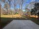 Expansive backyard featuring mature trees and a wooden fence creating a private outdoor space at 2784 Williamsburg Way, Decatur, GA 30034