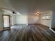 Spacious basement with gray plank flooring, ceiling fans, and access to the outside at 2784 Williamsburg Way, Decatur, GA 30034