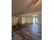 Basement with plank flooring and multiple doors leading to different areas at 2784 Williamsburg Way, Decatur, GA 30034