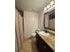 Cozy bathroom with a shower, toilet, and vanity with a granite countertop at 2784 Williamsburg Way, Decatur, GA 30034