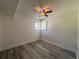 This bedroom offers plank flooring, ceiling fan, and a window with wooden blinds at 2784 Williamsburg Way, Decatur, GA 30034