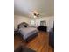 Comfortable bedroom with hardwood floors, a queen bed, and dark wood furniture at 2784 Williamsburg Way, Decatur, GA 30034
