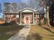 Lovely brick home featuring a columned porch, offering classic charm and curb appeal at 2784 Williamsburg Way, Decatur, GA 30034