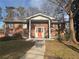 Beautiful brick home with a welcoming columned front porch and well-manicured lawn at 2784 Williamsburg Way, Decatur, GA 30034