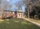 Classic brick home with a welcoming front porch and meticulously maintained lawn at 2784 Williamsburg Way, Decatur, GA 30034