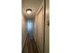 Long hallway with plank flooring, neutral walls, and access to other rooms at 2784 Williamsburg Way, Decatur, GA 30034