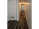 The hallway features plank flooring and neutral walls, leading to different areas at 2784 Williamsburg Way, Decatur, GA 30034