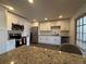 Bright kitchen featuring stainless steel appliances, white cabinets, and granite countertops at 2784 Williamsburg Way, Decatur, GA 30034