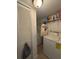 Laundry room with washer, dryer, and storage shelving, offering functionality at 2784 Williamsburg Way, Decatur, GA 30034