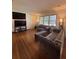 Bright and spacious living room with hardwood floors, large windows, and comfortable seating at 2784 Williamsburg Way, Decatur, GA 30034