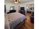 This main bedroom offers hardwood floors, a ceiling fan, and a walk-in mirrored closet at 2784 Williamsburg Way, Decatur, GA 30034