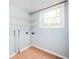 Unfinished basement area with shelving, window view, and tile flooring at 3201 Palomino Dr, Powder Springs, GA 30127
