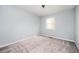 Bedroom with neutral carpet, light blue walls and natural light from the window at 3201 Palomino Dr, Powder Springs, GA 30127