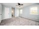 Bedroom with carpet, ceiling fan, two closets, and an ensuite bathroom at 3201 Palomino Dr, Powder Springs, GA 30127