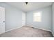 Bedroom featuring neutral carpet, light blue walls, and a white door at 3201 Palomino Dr, Powder Springs, GA 30127