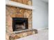 Close up of the fireplace with stone surround and white mantle at 3201 Palomino Dr, Powder Springs, GA 30127