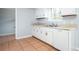 Kitchen featuring white cabinets, tile floors, and modern appliances at 3201 Palomino Dr, Powder Springs, GA 30127