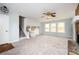 Spacious living room with a stone fireplace, large windows, and new carpeting at 3201 Palomino Dr, Powder Springs, GA 30127