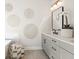 Stylish bathroom with gray vanity, decorative wall art, statement mirror, and modern lighting creating a serene atmosphere at 235 Briscoe Way # 7, Alpharetta, GA 30009