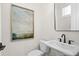 A powder room with a pedestal sink, and neutral decor at 235 Briscoe Way # 7, Alpharetta, GA 30009
